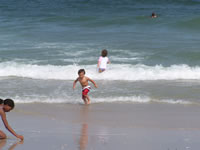 August 2006 Photos: Alex and Skye playing in the ocean at Island Beach State Park, NJ