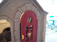 August 2006 Photos: Alex in his playhouse back in NM