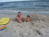 August 2006 Photos: Alex and Chris DeMerrit playing in the big hole they dug.