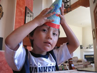 Max's first birthday: Alex with a birthday hat.