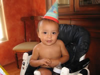 Max's first birthday: The birthday boy withhis hat on.