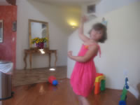 Max's first birthday: Alex took this picture of Carissa dancing.