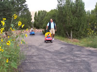 September 2006 Photos: Chris, Alex and Max coming down our driveway.