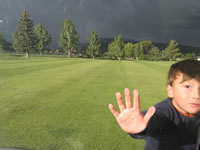 September 2006 Photos: Alex at Hillcrest in Durango, there is snow coming down on the mountain behind him!