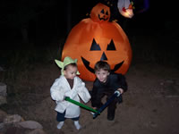 October 2006: Alex and Max in our front yard getting ready for Halloween