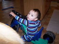 November 2006: Max riding Alex's big wheel