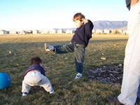 November 2006: Playing kick ball at the park (no, Alex is not punting Max)