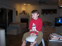 December 2006: Alex riding atop his cozy coupe cop car