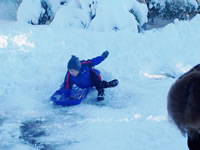 December 2006: Alex sledding