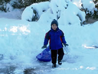 December 2006: Alex loves sledding!!!