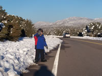 December 2006: Alex on a walk in the snow on our street