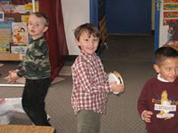 December 2006: Alex at his pre-school Christmas Program, helping to play and sing 'Jingle Bells.'