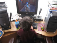 December 2006: Alex playing Lego Star Wars on the computer, one of his very favorite things to do!