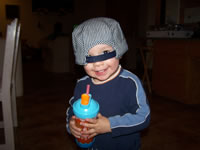 February 2007: Max with his favorite peek-a-boo hat.