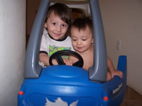 February 2007: Alex and Max just barely fit together in the little car. We have to find a two-seater!