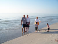 February 2007: With Nana and Grandpa on the beach in Naples