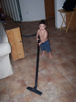 March 2007: Max vacuuming the floor.