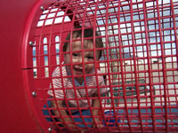 March 2007: Maxie in the crawl-through cage at the play park.