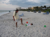 March 2007: Chris and I partially buried Alex in the sand, which he thought was great fun!