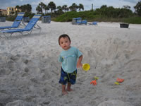 March 2007: Max playing in a big hole someone dug on the beach.