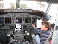 March 2007: The Southwest pilot was so cool! He let Alex sit in the cockpit with him and ask a bunch of questions about all the levers, buttons, dials and gauges. Alex was in awe. It was great.