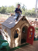 April 2007: Alex on the roof of his play house, doing some repairs.