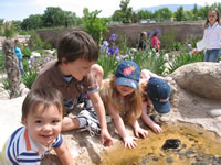 May 2007: Playing in a rock fountain ant the biopark.