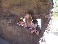 May 2007: Playing in the caves at the gardens