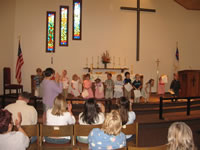 May 2007: Alex's Preschool class graduation. He is 5th from the right. They all got diplomas!