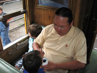 June 2007: Chris and the boys riding Thomas the Tank Engine in Durango.