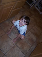 July 2007: Alex pretending to be a kitty, although he looks like a frog here.