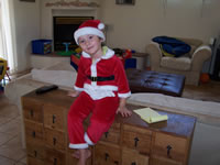 August 2007: Alex and Max wanted to dress up like Santas for some reason. Very funny.