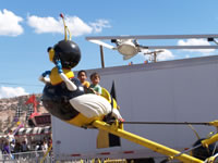 Sept 2007: Alex and Logan flying on a bumblebee ride at the Navajo Nation Fair.