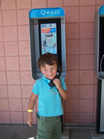 Sept 2007: Now we are at the New Mexico State Fair in Albuquerque, weekend following trip to Window Rock for the Navajo Nation Fair. This was very funny! I'm not sure Alex had ever really seen a pay phone. He was fascinated. Chris called one from his cell phone and Alex answered. He was amazed! He and Max played on the phones for quite awhile.