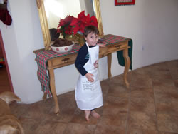 December 2007: Alex in apron, helping bake holiday goodies.