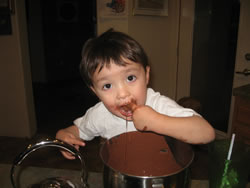 January 2008: Max helping with some cup cake batter.