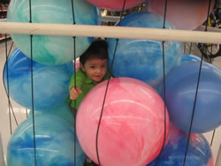 January 2008: Max climbed into one of the huge bins of bouncy balls at Walmart. 