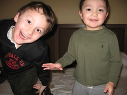 January 2008: Alex and Max jumping on the bed at Tamaya