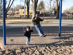 February 2008: Max and Chris on the swings.