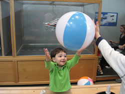 February 2008: Max doing an experiment with floating a beach ball in an air current at the Explora Museum.