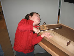 February 2008: Alex playing 'violin' at Explora.