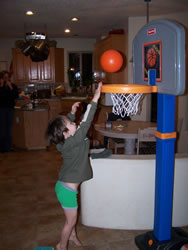 March 2008: Alex playing basketball with the hoop he got for his 5th birthday from Nana and Grandpa