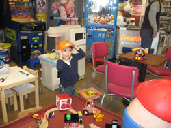 March 2008: Max with construction helmet. (this ice cream place is amazing! they have thousands of toys and dozens of dress up hats and accessories. the kids had a ball!))