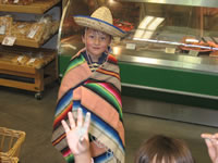 September 2008 Photos: Alex in a serape at the local grocery store. He took it off of a display!