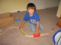 October 2008 Photos: Max building a railroad at a friend's house