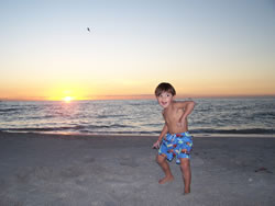 November 2008: We watched "Kung Fu Panda" and this is Max doing his kung fu routine on the beach.