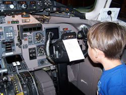 December 2008: Alex checking out the instruments in the cockpit on the way back to ABQ