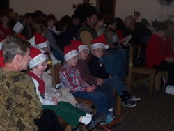 December 2008: Alex and class. (I have posted a video of the singing. see link at top of page)