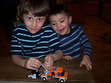 January 2010: Building a Lego from the Alabama cousins.