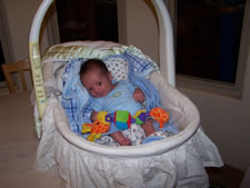 July 2010: Zeke in the bassinet